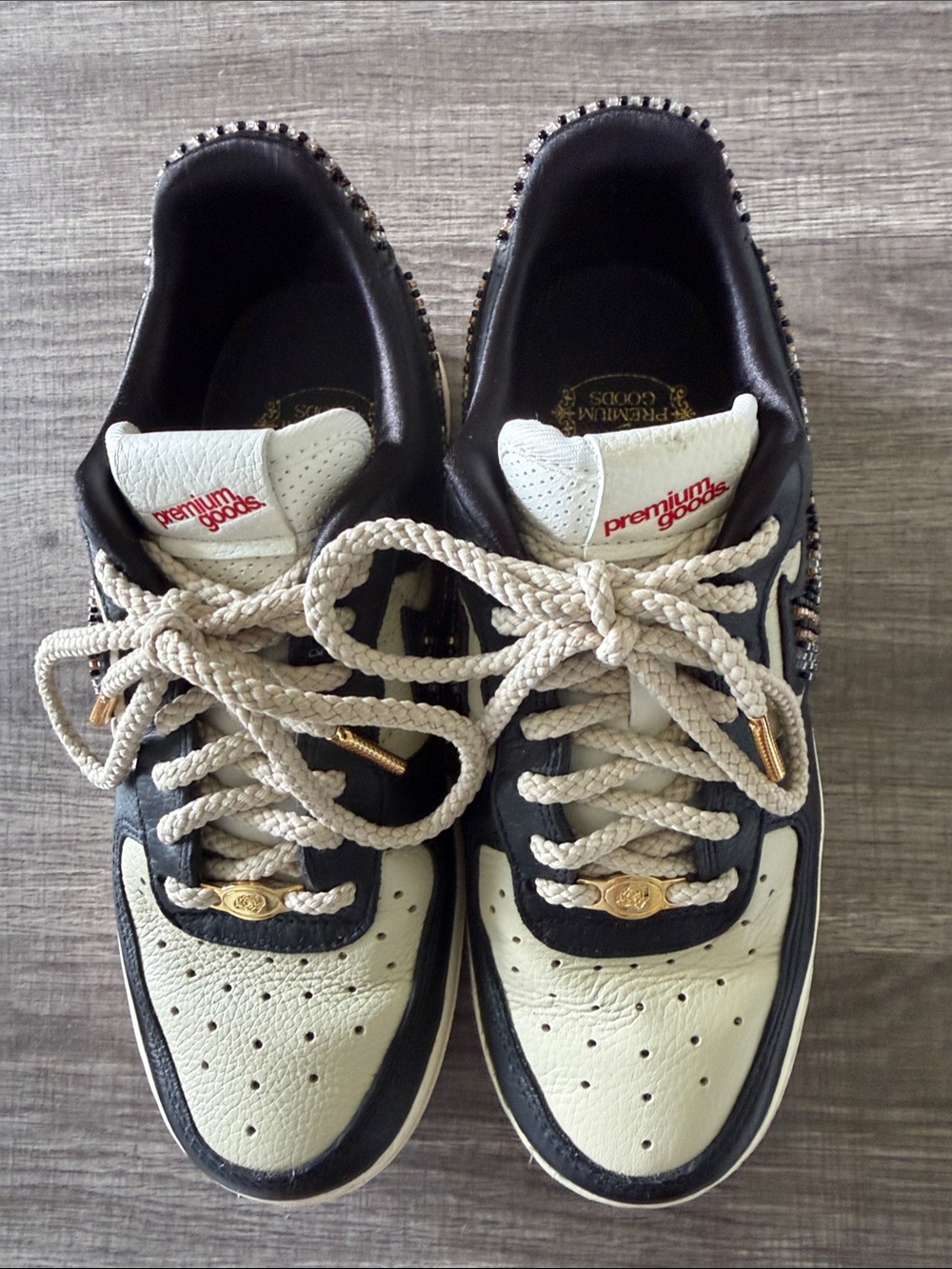 Nike Black and Cream Low-Top Sneakers with Gold Accents